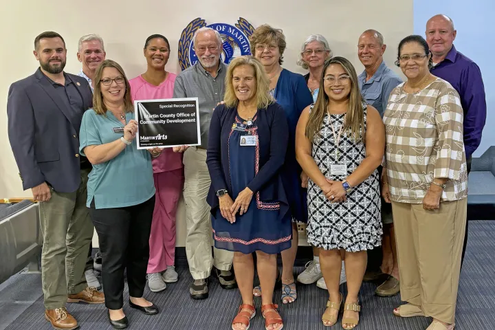 Image of Martin County Office of Community Development staff and CRA Board Members smiling in a group photo for being recognized for a 2024 MartinArts Award.