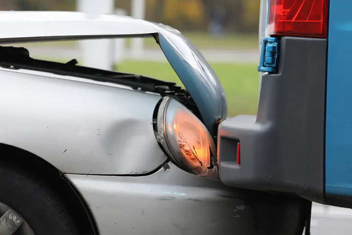 A silver car involved in a fender bender