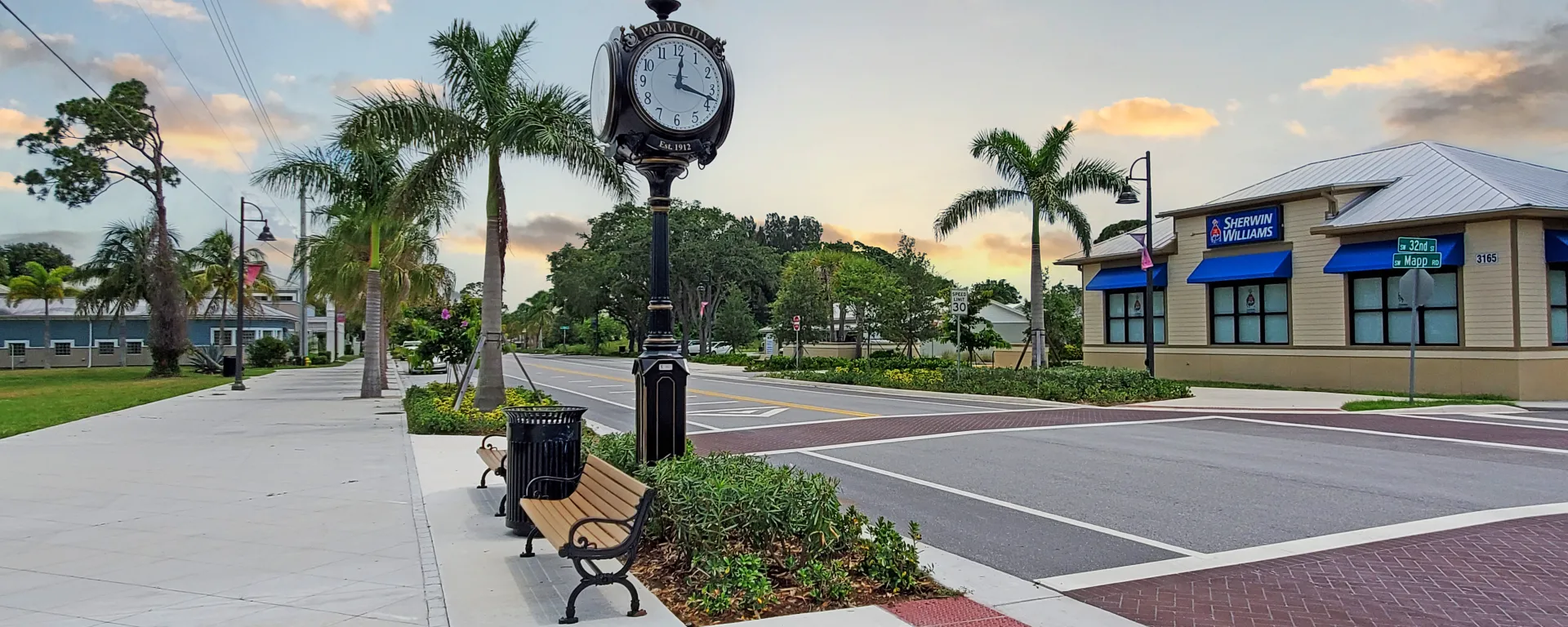 Image of Mapp Road in Palm City during sunrise with a view of the vintage town square clock.