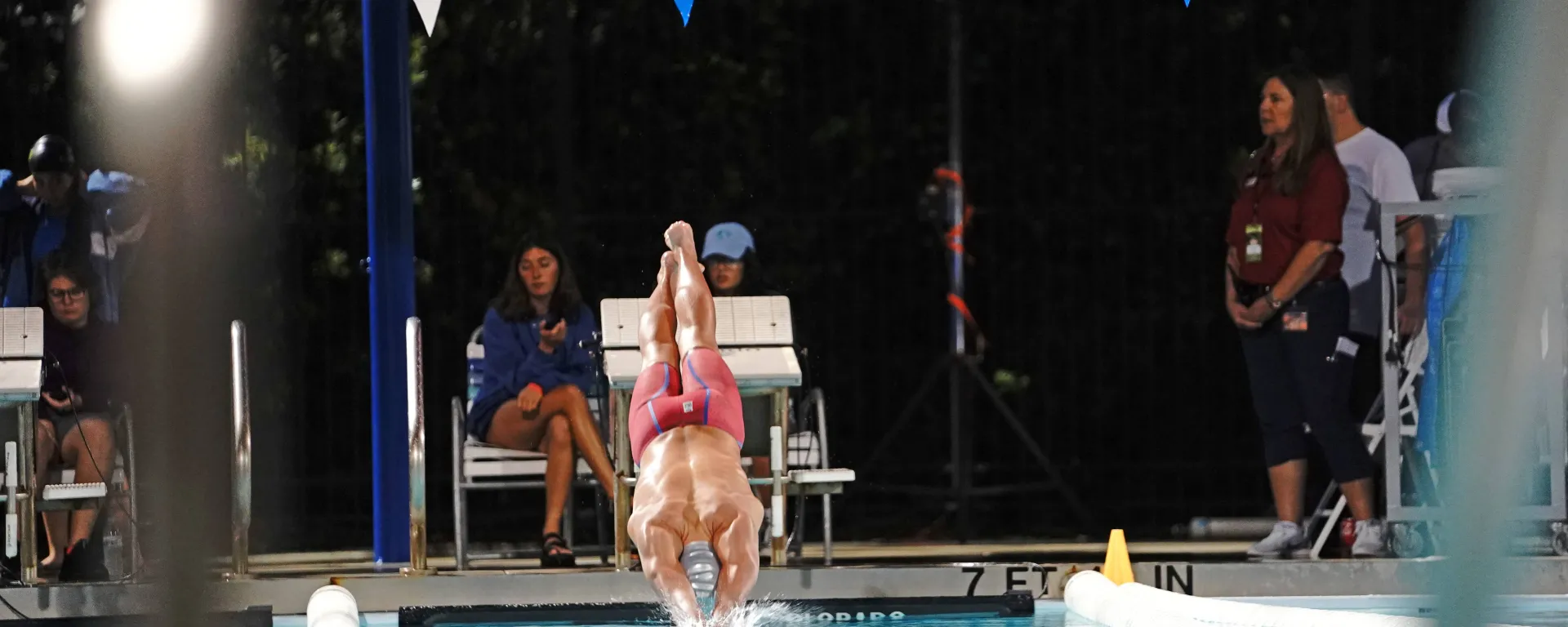Image of a swimmer diving into the lap pool at Sailfish Splash Waterpark