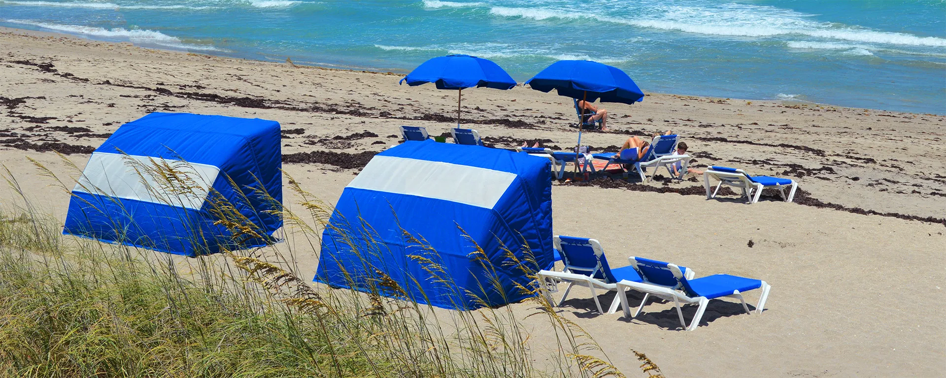 Beach chairs, clamshells, and umbrellas at Jensen Beach.