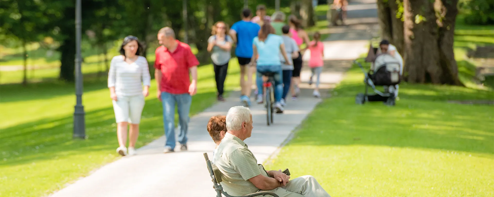 People walking and biking along a shared use pathway