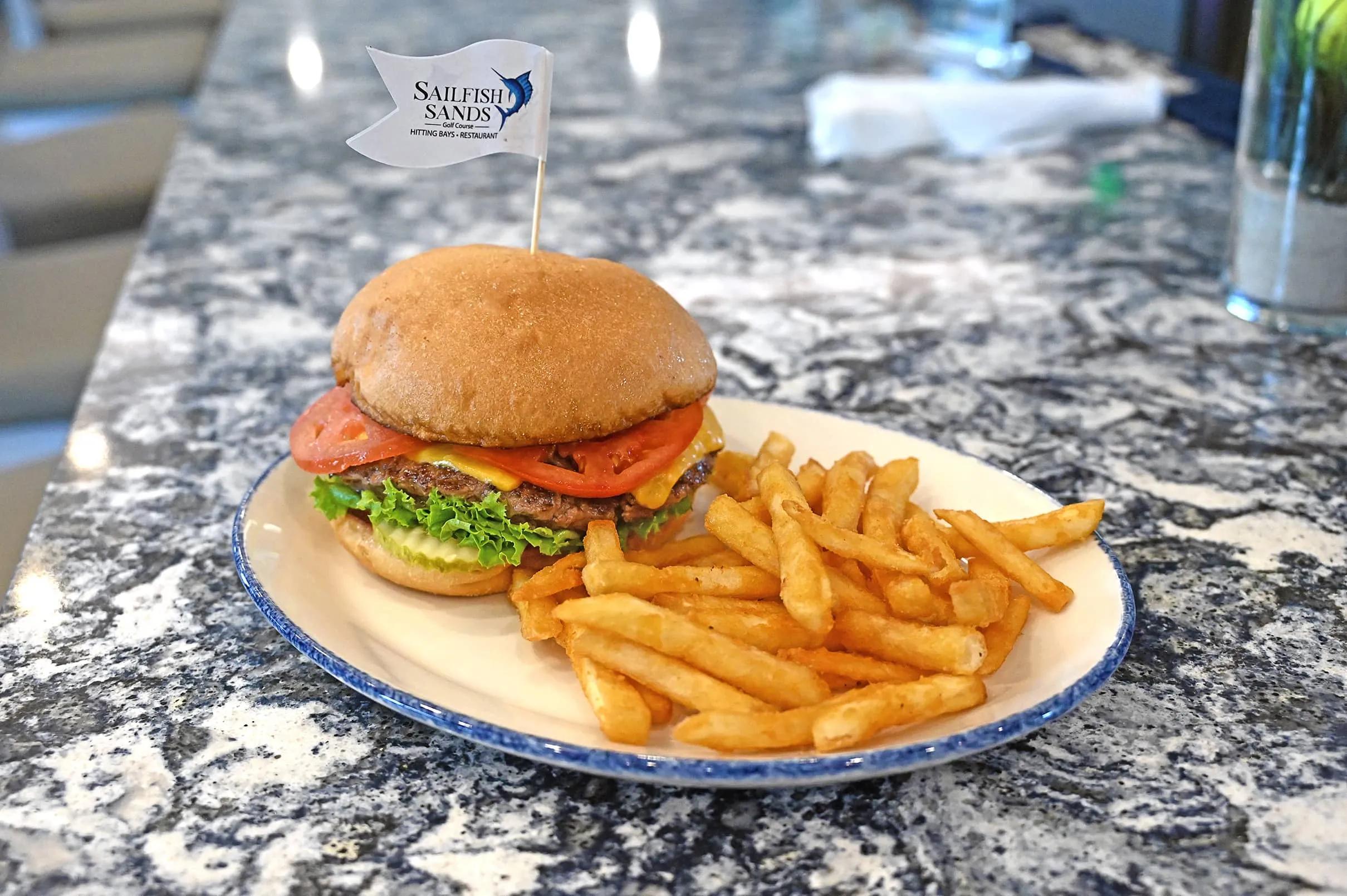 Cheeseburger with a side of fries at Sailfish Sands