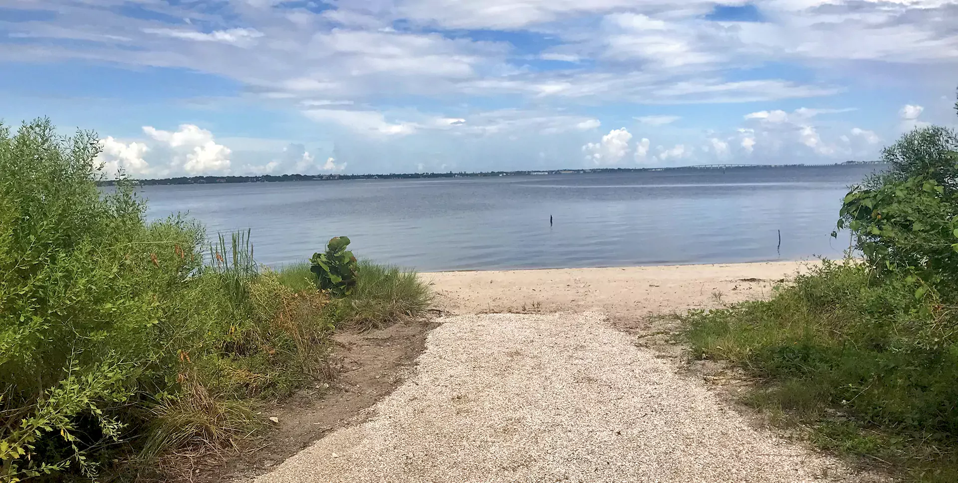 A sandy path leading to the Indian River Lagoon at River cove